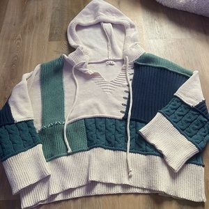 Very thick patch sweater. Very cute and cozy. Oversized fit.